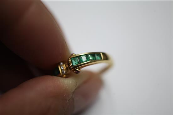 A stylish 18ct gold, emerald and diamond ring, size O.